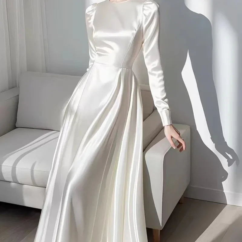 White long sleeved satin dress for women in autumn 2024, unique and beautiful French style waist cinched long skirt for summer